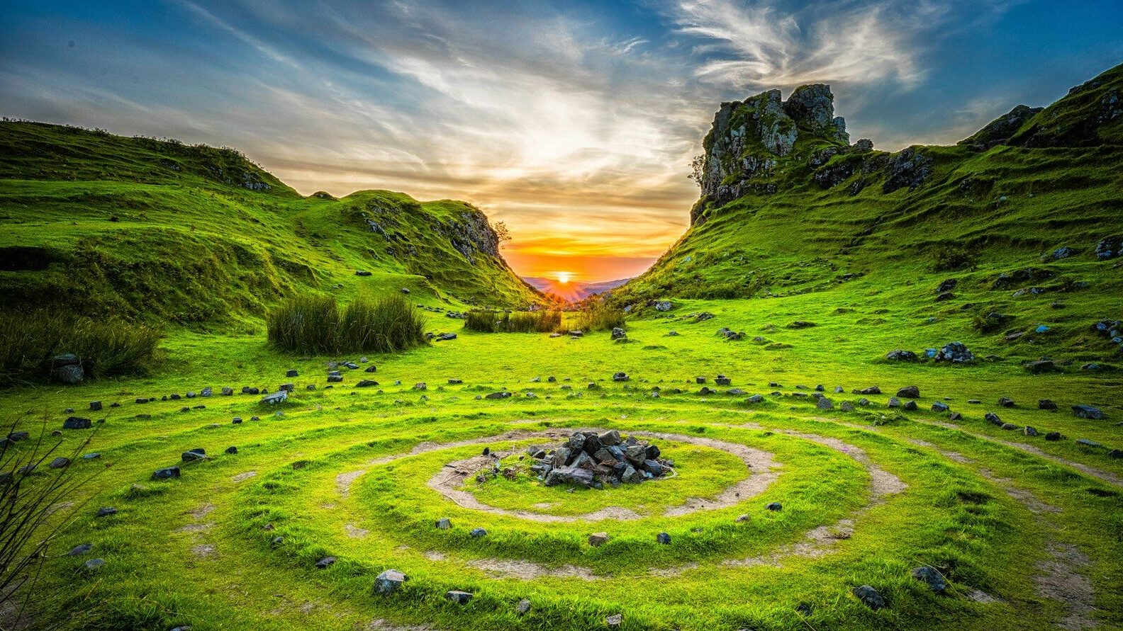 green grass field during sunset